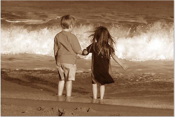 Children holding hands on the Beach